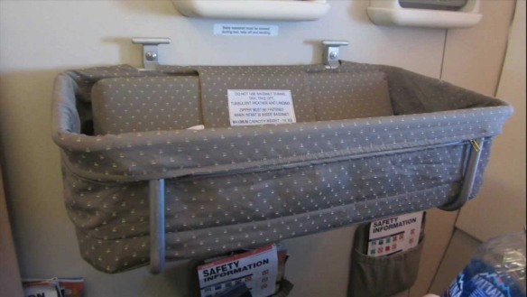 Check the dimensions and weight limit of airplane bassinets and take your own baby blanket